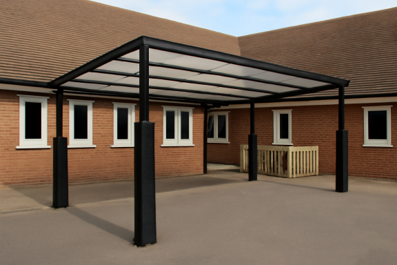 Flat Roof Playground Shelter Rain-proof shelter fabricated by Gateway Fabrications in Hull and Wellingborough. Delivering Across the UK.